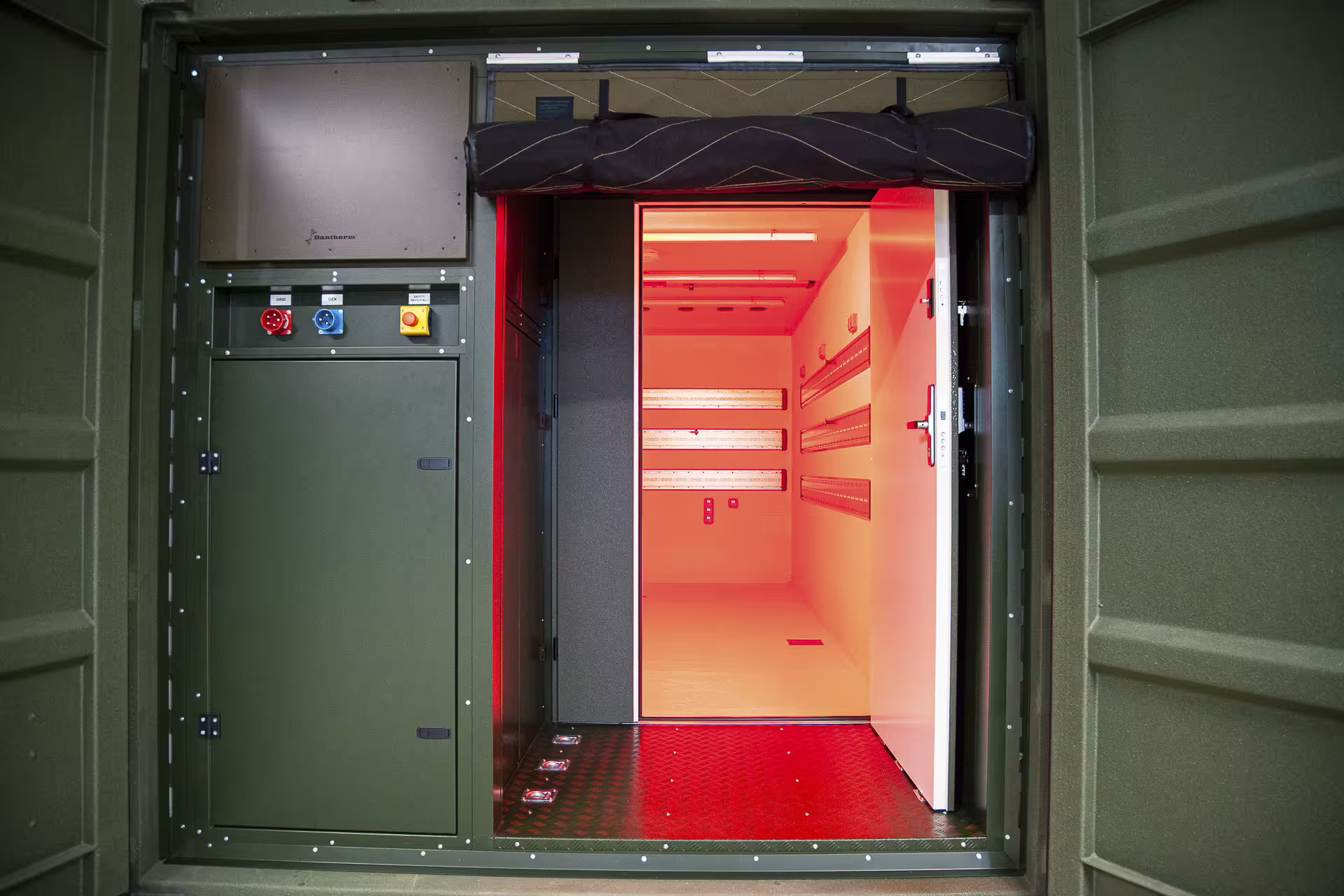FlexiPod deployable container with power distribution panel and red-lit technical interior.