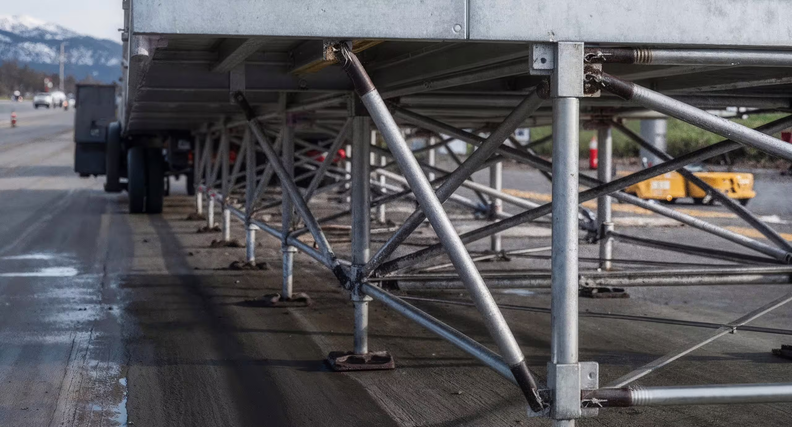 The understructure of a loaded Air Cargo Dock bay, galvanized tube legs and cross-bracing bolted together