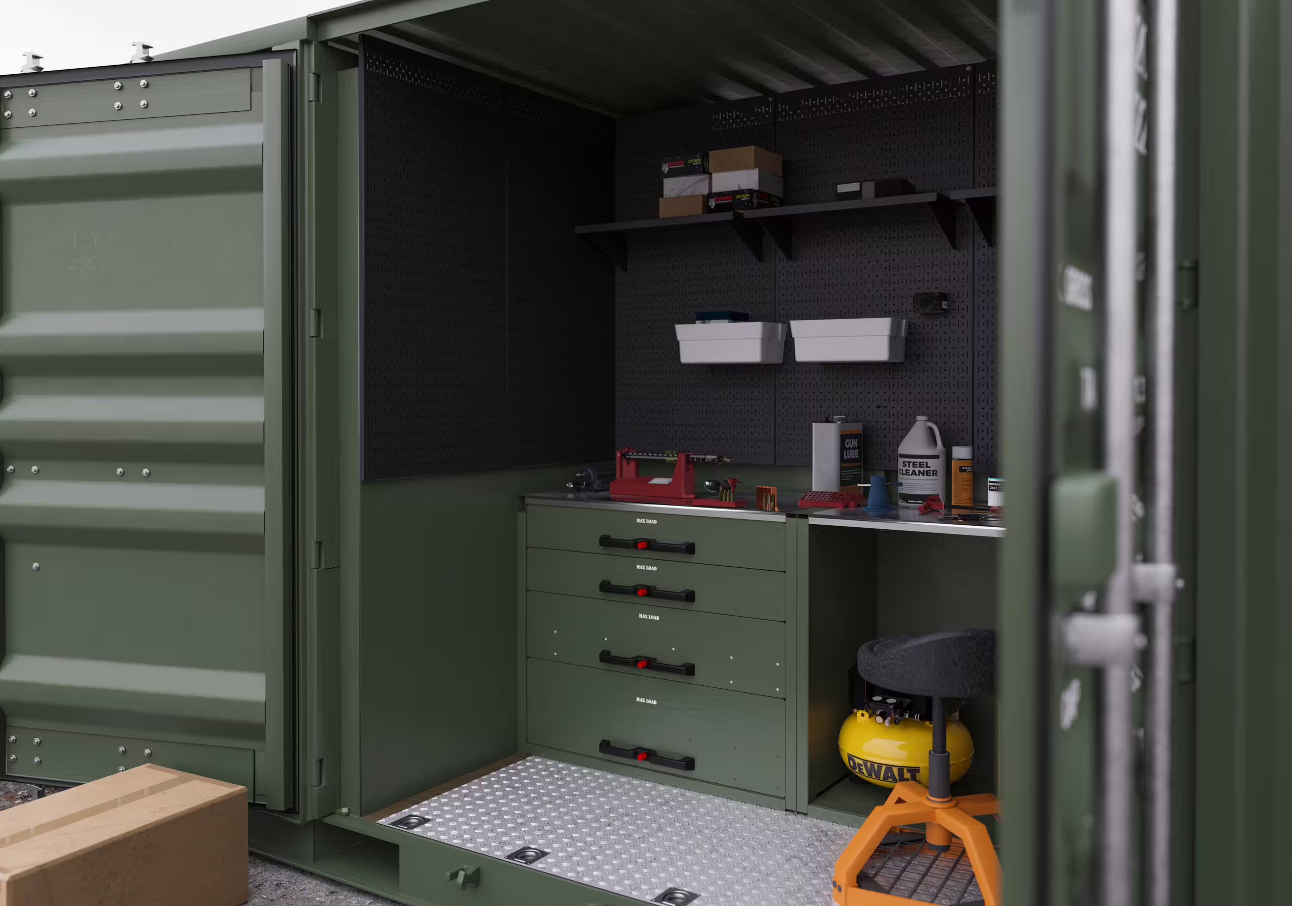 The interior of a Rackbox workstation module: a steel bench with a vice, a perforated tool wall with shelves above, a four-drawer stack below and a chequer-plate tray floor, personnel door open to the left